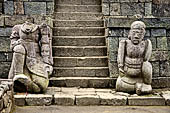 Candi Cetho - Guardians standing on the ninth terrace at the base of the staircase leading to the tenth terrace. 